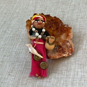 Worry Doll Brooch with Mother of Pearl Bird